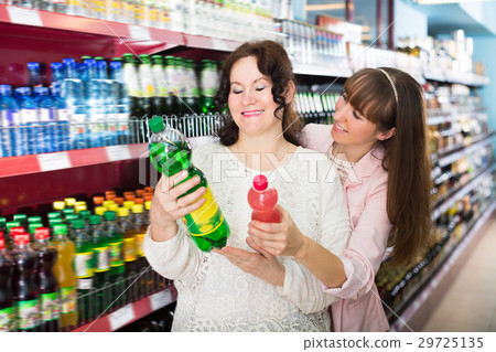 Portrait of adult women shopping in market 29725135