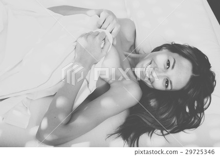 lying with sheet naked 29725346