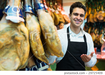 Seller in delicatessen section 29725409