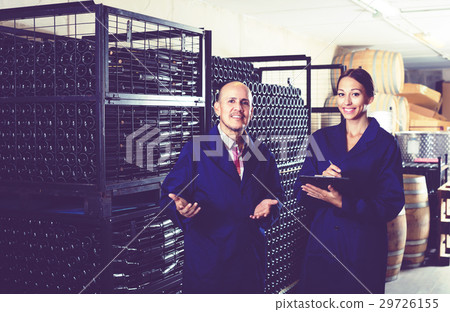 Girl with cardboard standing with worker Girl with cardboard standing with worker 29726155