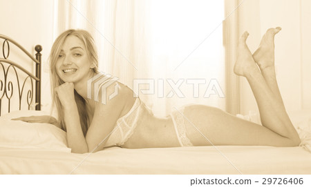 Beautiful girl in sexy semi-transparent lingerie. Toned Beautiful girl in sexy semi-transparent lingerie. Toned 29726406