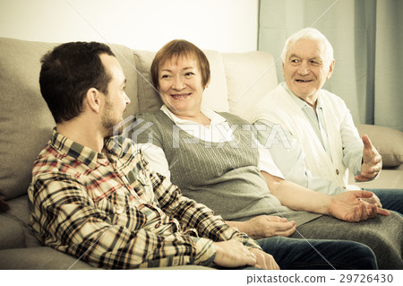 Parents and son enjoying evening 29726430