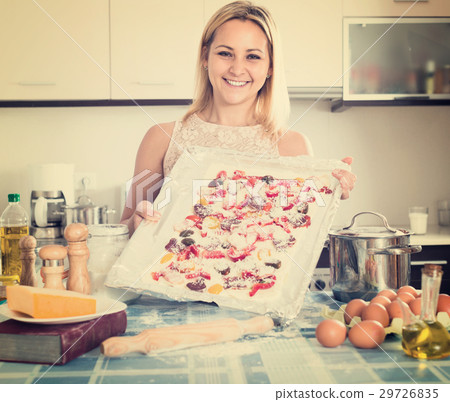 Smiling woman posing with pizza Smiling woman posing with pizza 29726835