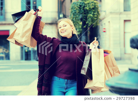 Girl holding shopping paper bags . 29727398