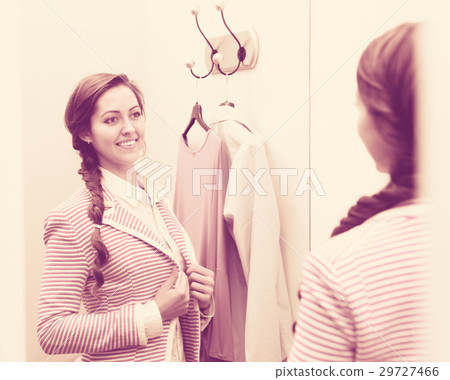 Girl at boutique changing cubicle 29727466