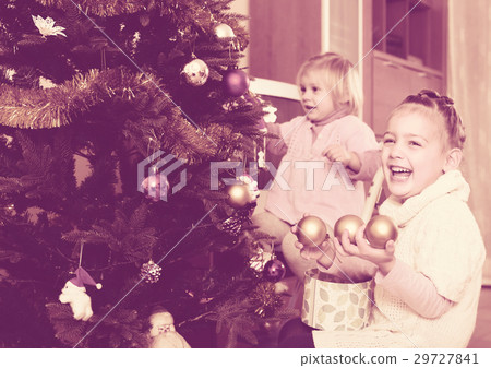 Happy children decorating a fir Happy children decorating a fir 29727841