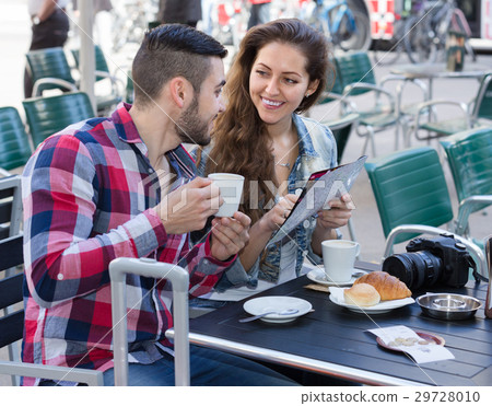 couple drinking coffee in restaurant couple drinking coffee in restaurant 29728010