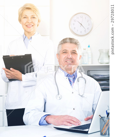Doctor and nurse waiting for patients Doctor and nurse waiting for patients 29728011