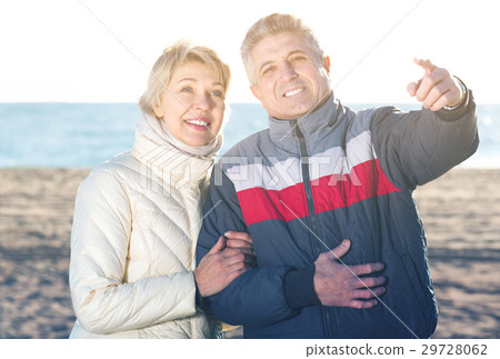 Cheerful husband points to something interesting 29728062