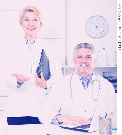 Doctor and nurse waiting for patients Doctor and nurse waiting for patients 29728190
