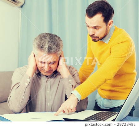 Adult father and son discuss contract Adult father and son discuss contract 29728485