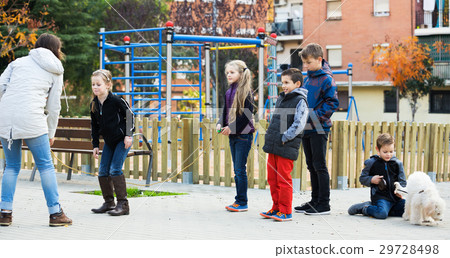 Children playing skipping rope 29728498