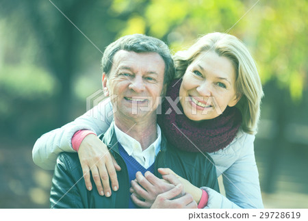 Mature loving couple in spring park Mature loving couple in spring park 29728619