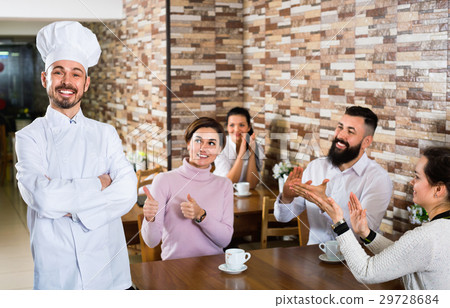 Happy chef listens to praise of the food 29728684