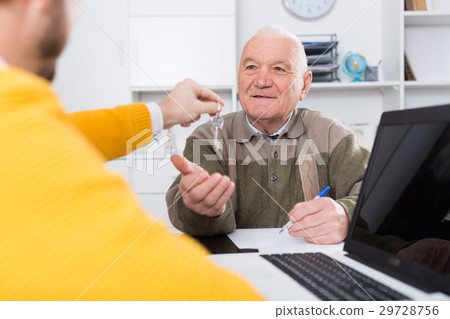 Old man and agent sign lease contract 29728756