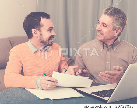 Man and sales manager discuss contract Man and sales manager discuss contract 29728853