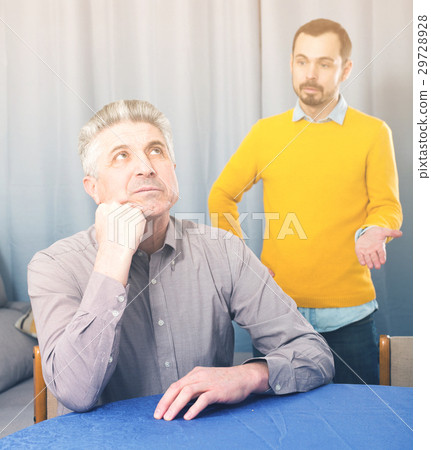 Son criticizes his mature father Son criticizes his mature father 29728928