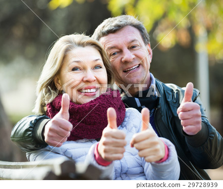 Portrait of mature couple in park . 29728939