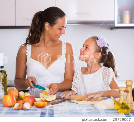Woman and child cooking strudel Woman and child cooking strudel 29729067