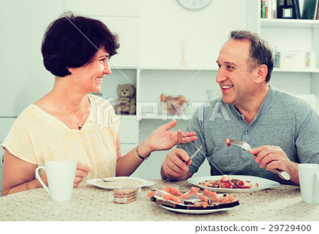 mature couple eating lunch at home . 29729400