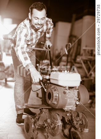 Male worker practicing his skills with plough 29729738