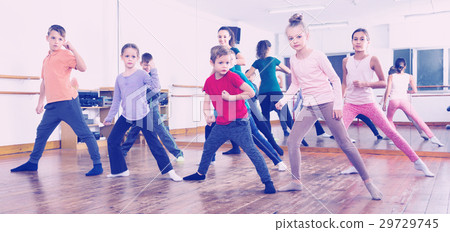 Children dancing contemp in studio smiling and having fun Children dancing contemp in studio smiling and having fun 29729745