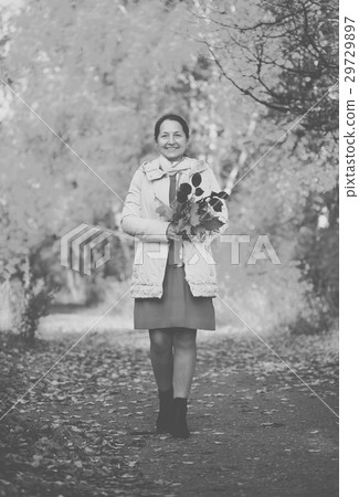 walking woman in autumn park walking woman in autumn park 29729897