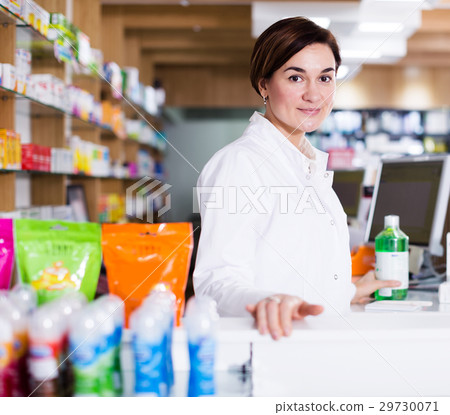 Pharmacist ready to assist in choosing at counter 29730071