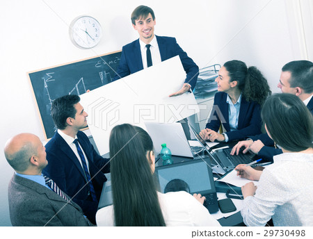 Businessman presents new development plan at poster 29730498