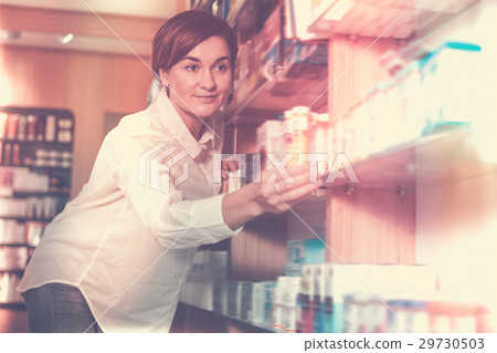 Young female searching for body care products 29730503