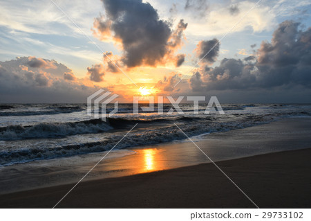 sunrise over the sea beach, cloudy 29733102