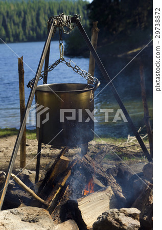 Camping fire on a lake shore Camping fire on a lake shore 29738872
