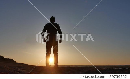 freedom. Man stands on a cliff sunset silhouette freedom. Man stands on a cliff sunset silhouette 29739532