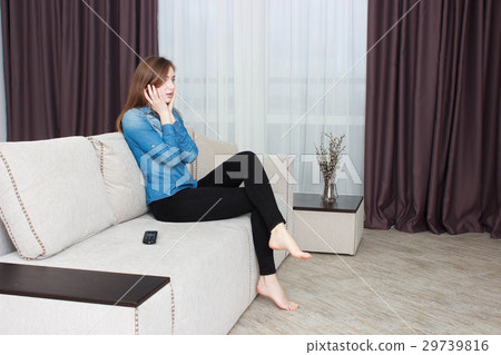 Young woman In black pants and a blue shirt Young woman In black pants and a blue shirt 29739816