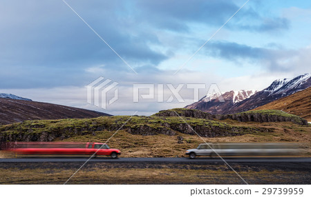 Two car facing together on country road in sunset 29739959