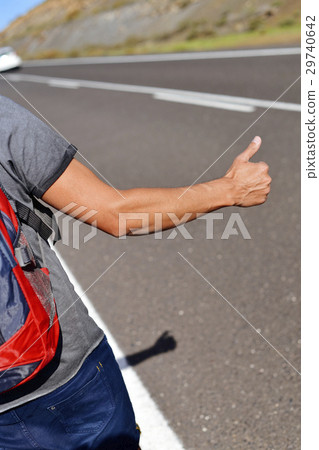 young backpacker man hitchhiking 29740642