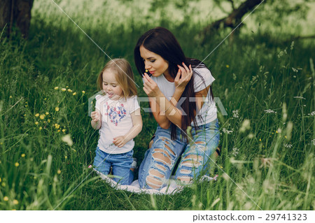 child near tree with mom 29741323