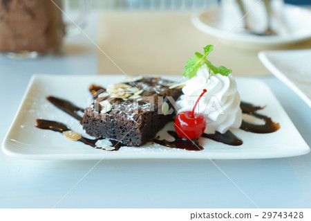 Chocolate brownie cake with whipped cream Chocolate brownie cake with whipped cream 29743428