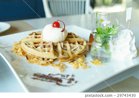 Waffle with vanilla ice cream and honey sauce Waffle with vanilla ice cream and honey sauce 29743430