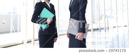 Part cut of business woman talking in the lobby 29745178