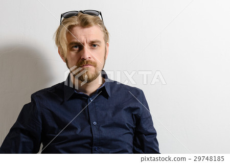 Attractive man in blue shirt and sunglasses Attractive man in blue shirt and sunglasses 29748185