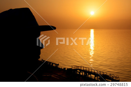 Silhouette man on sunset background 29748815