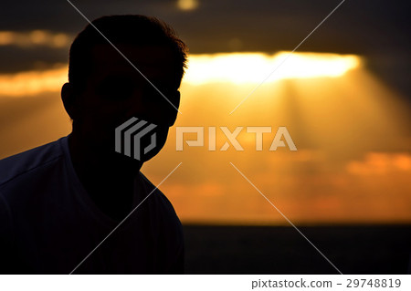 Silhouette man on sunset background Silhouette man on sunset background 29748819