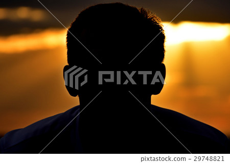 Silhouette man on sunset background Silhouette man on sunset background 29748821