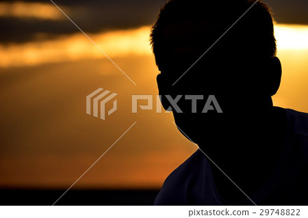 Silhouette man on sunset background Silhouette man on sunset background 29748822