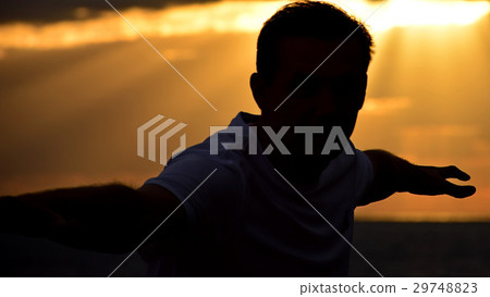 Silhouette man on sunset background 29748823