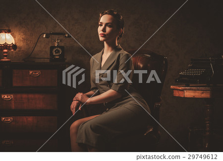 Beautiful young woman in retro interior 29749612
