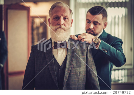 Tailor and his senior clinet in a workshop 29749752