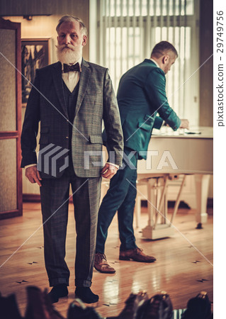 Senior client at tailor's workshop Senior client at tailor's workshop 29749756