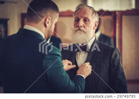 Tailor and his senior clinet in a workshop 29749795